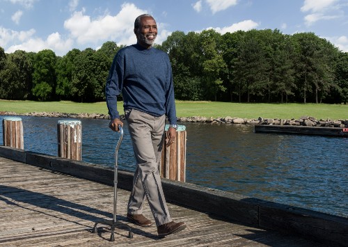 Man Walking with Drive Quad Cane