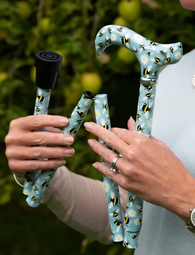 This walking stick features a sweet, brightly coloured ladybird pattern